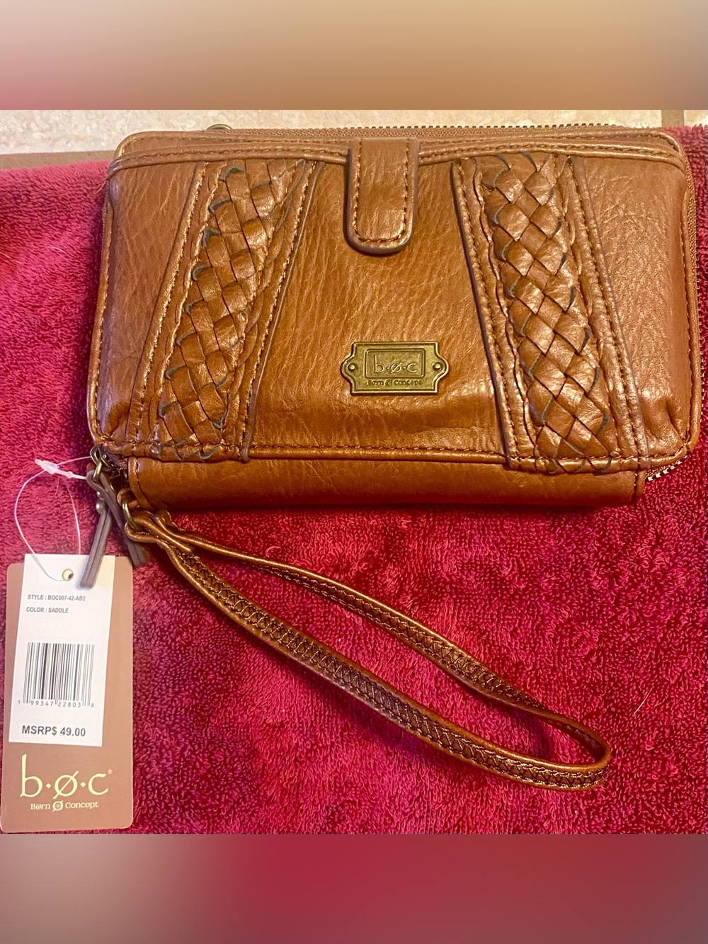 b.ø.c. (Born Concept) saddle brown zip-around wristlet braided side panels